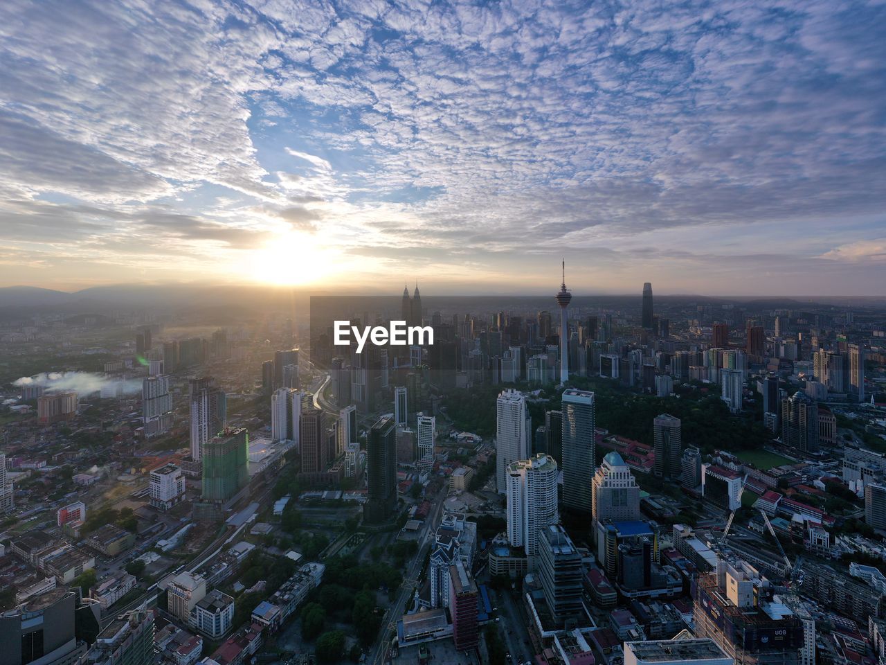 Aerial view of city buildings during sunset