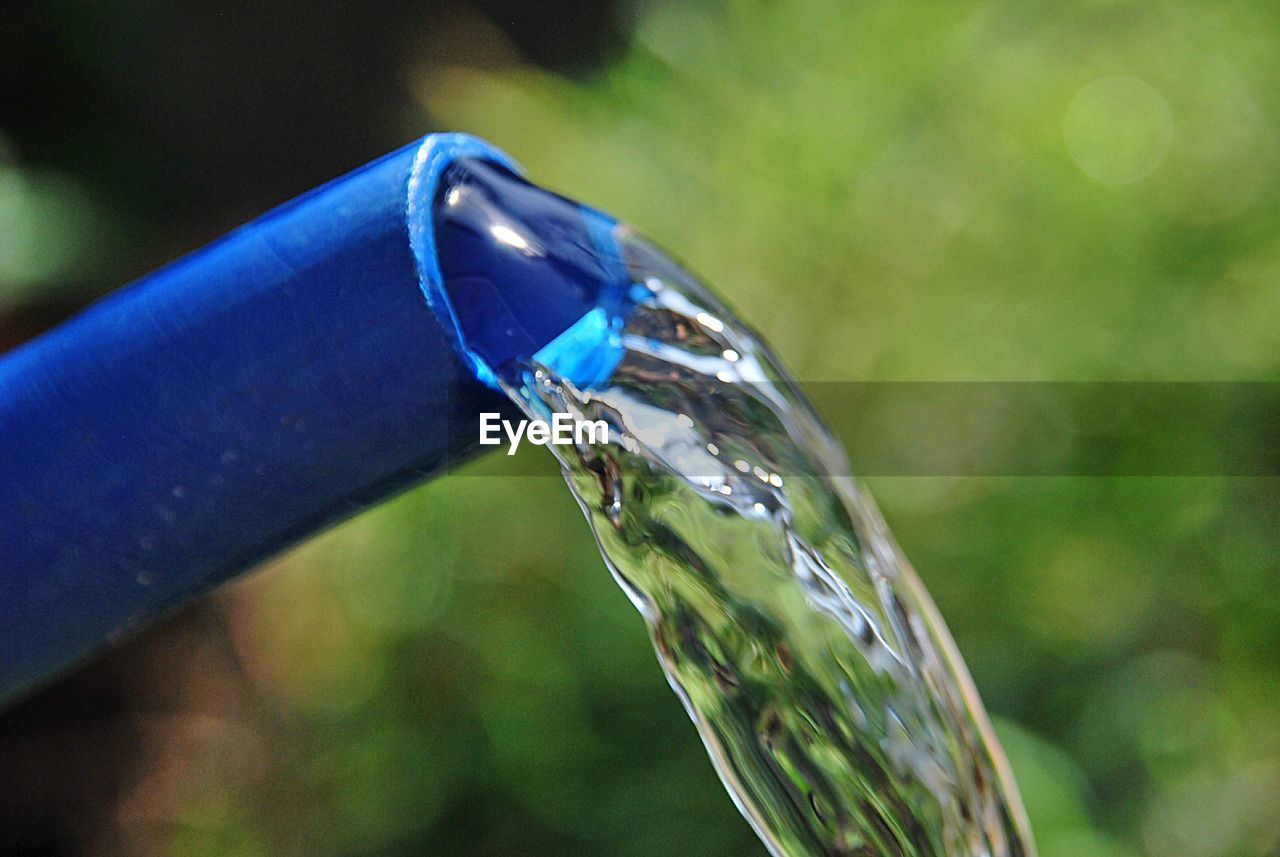 Close-up of water drop on glass