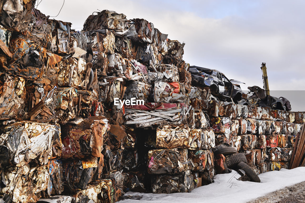 STACK OF GARBAGE BY METAL STRUCTURE