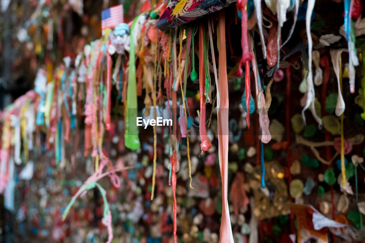 Close-up of multi colored bubble gum hanging outdoors