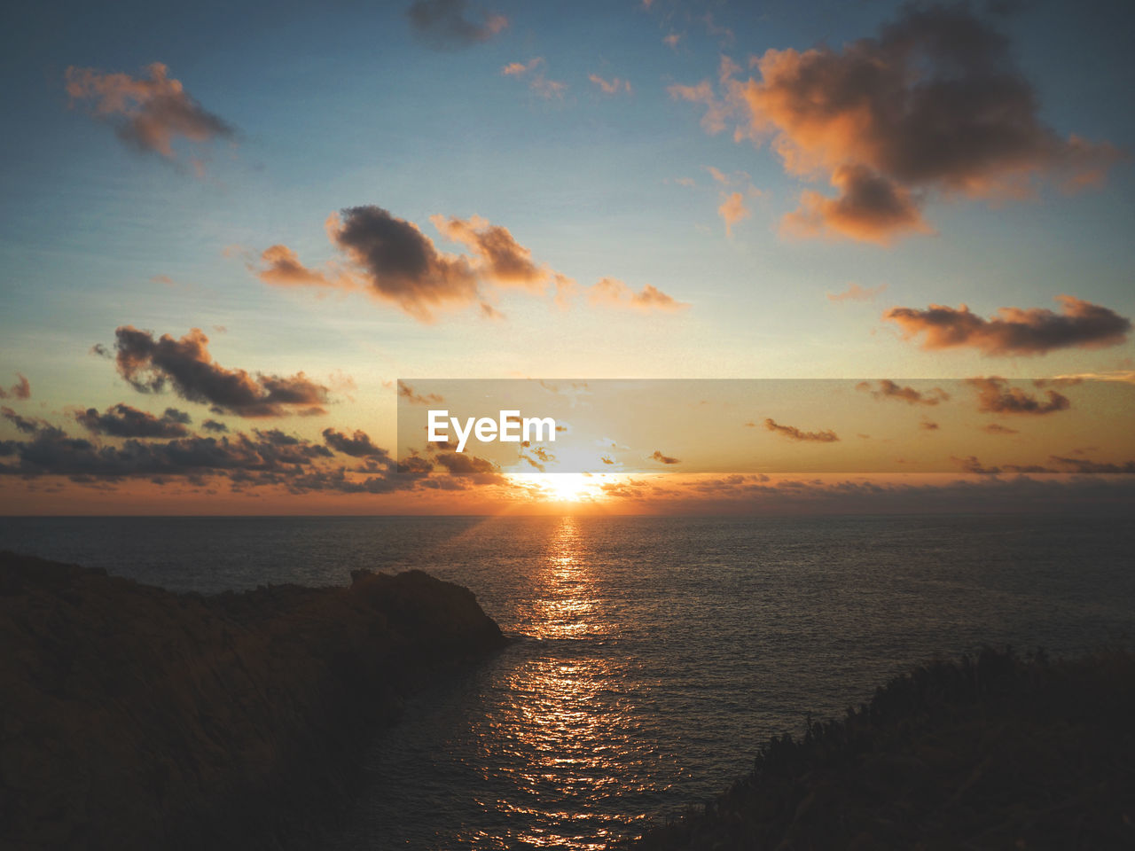 Scenic view of sea against sky during sunset