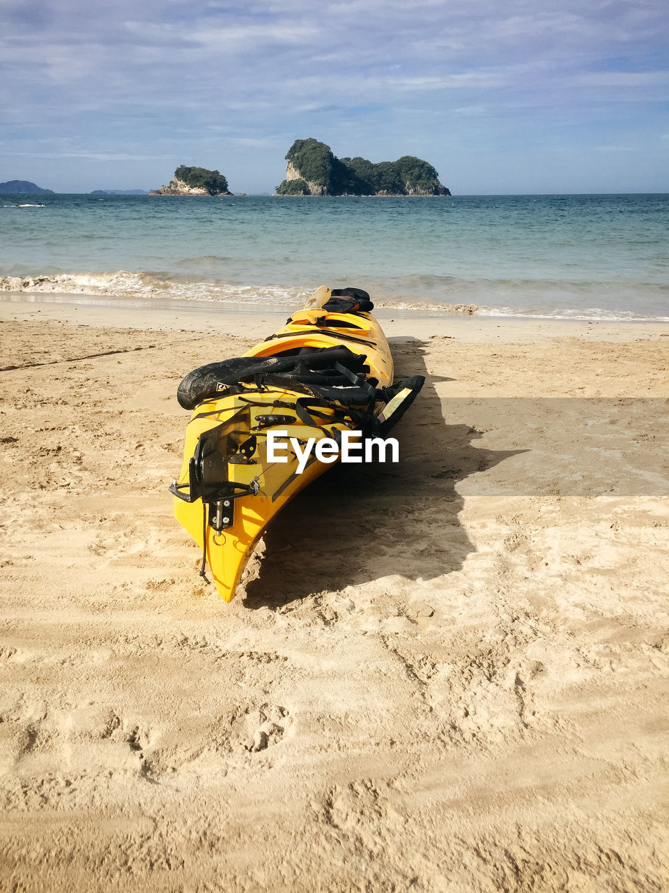Boat at beach against sky