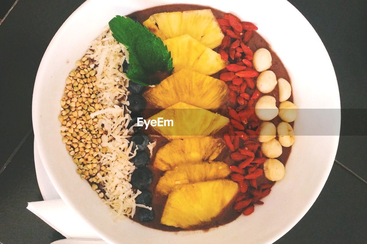 High angle view of fruits and sprouts in plate