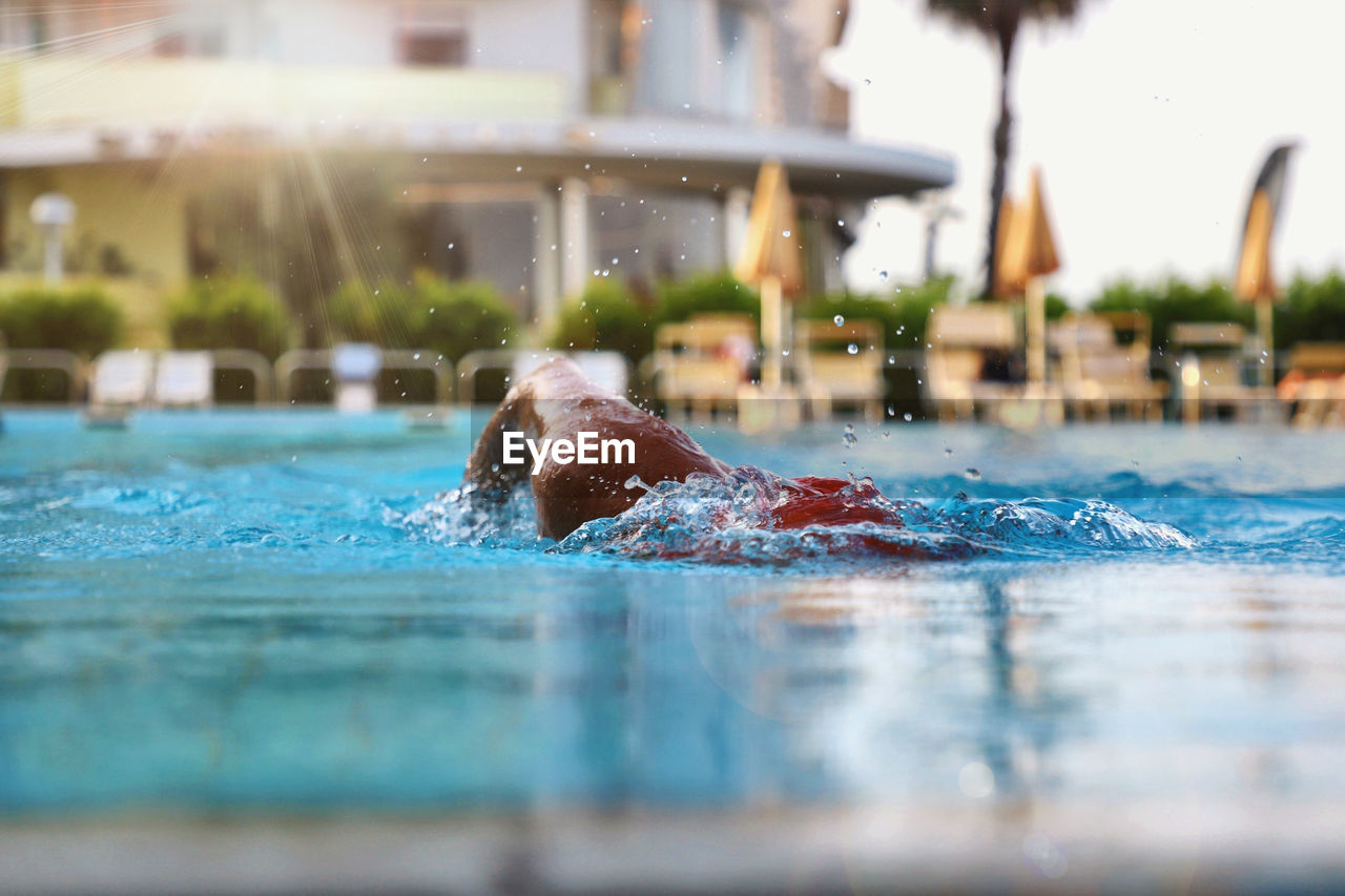 Man swimming in pool