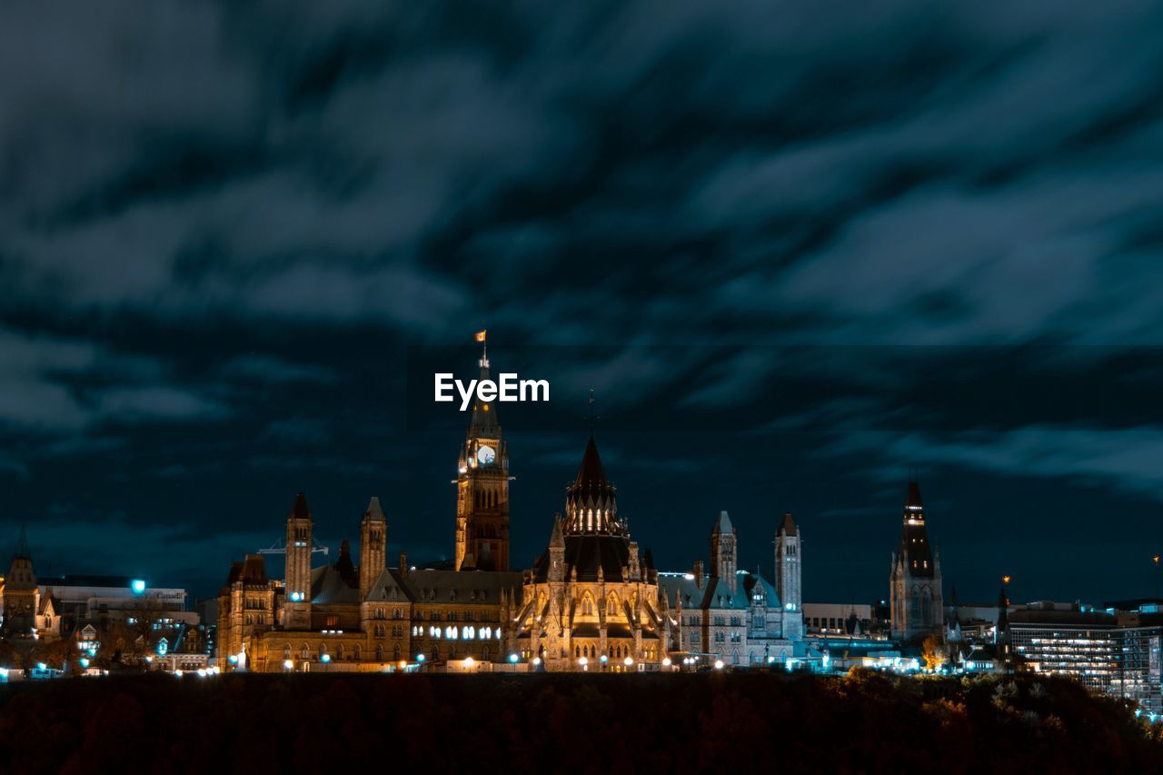 Illuminated buildings in city at night