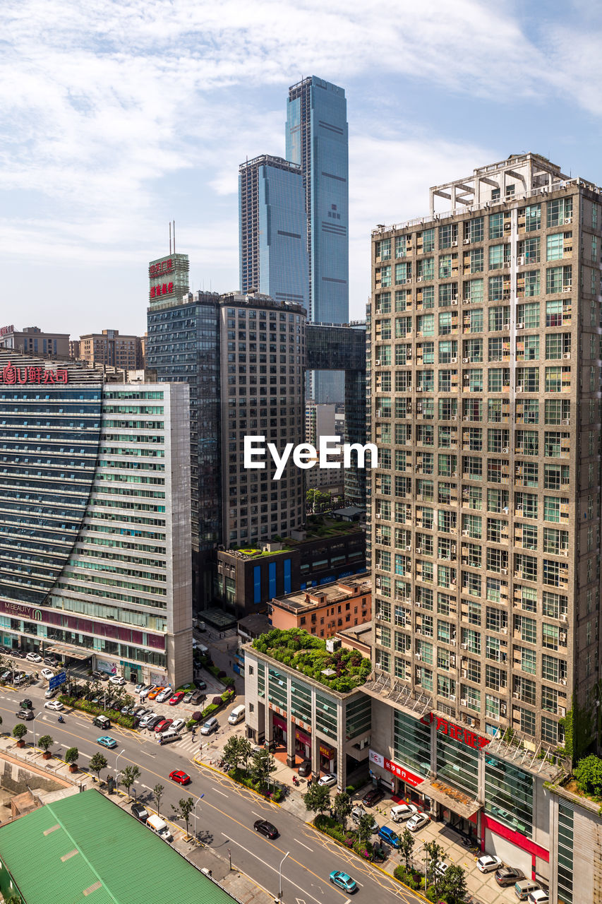 High angle view of buildings in city against sky