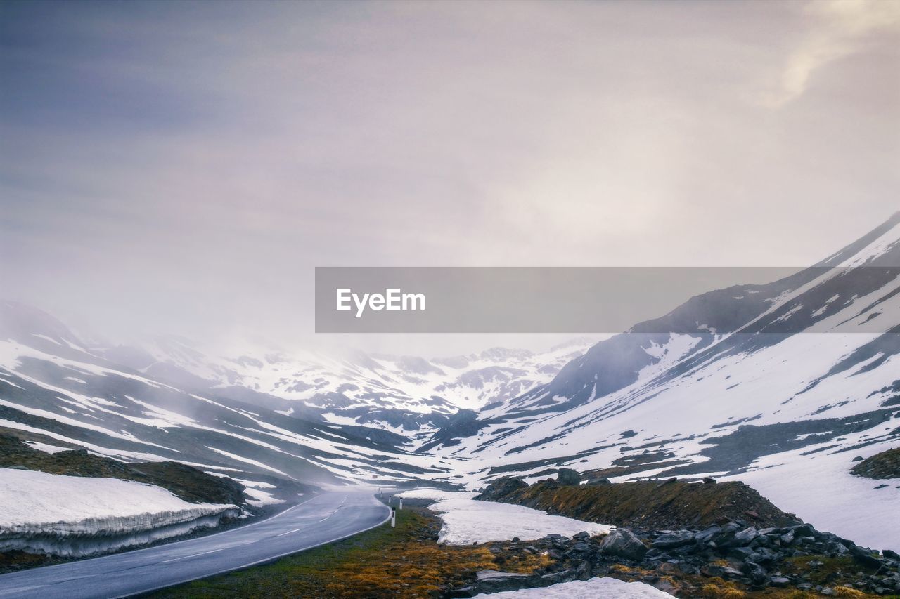 Scenic view of snowcapped mountains against sky