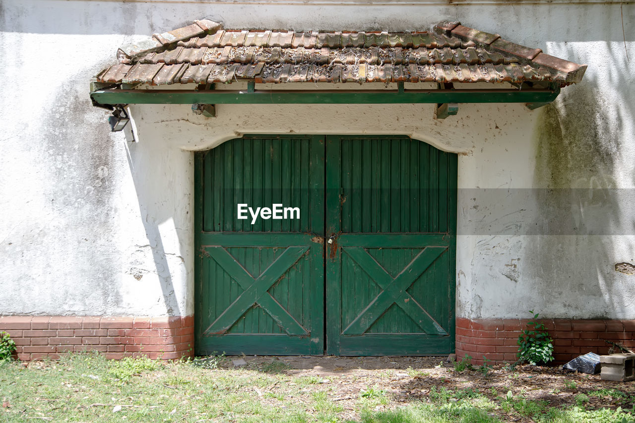 closed wooden door of house