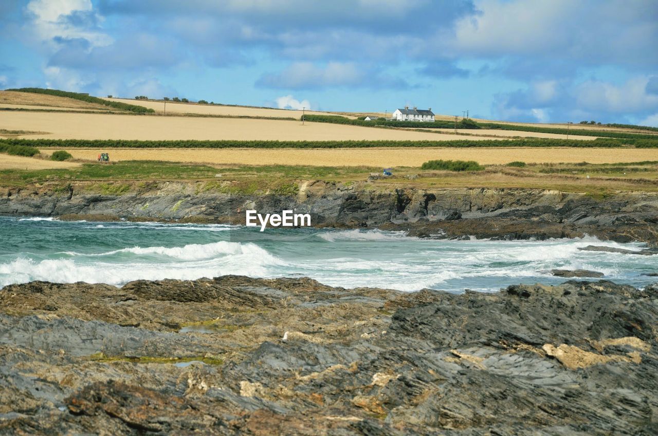 Scenic view of sea against cloudy sky