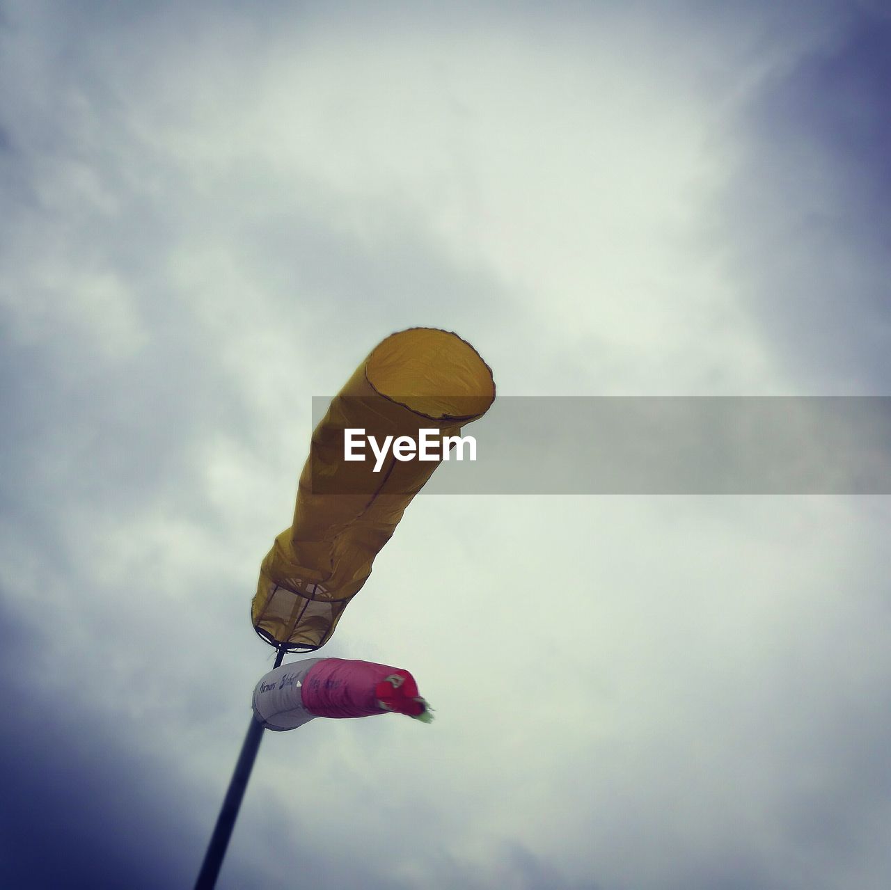 CLOSE-UP OF MAN AGAINST SKY