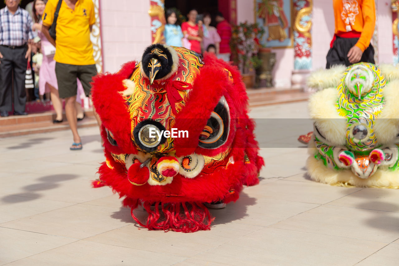 CLOSE-UP OF SCULPTURE IN TRADITIONAL CLOTHING