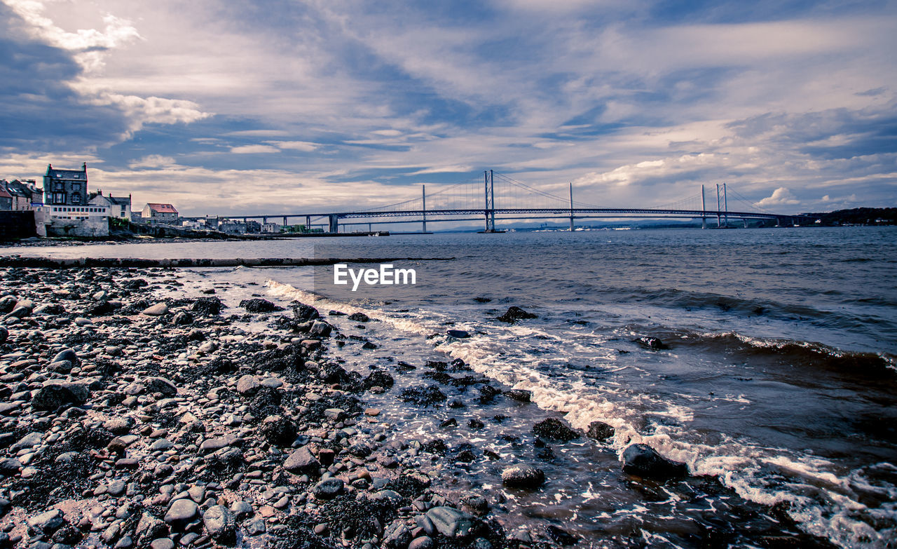 Bridge over sea against sky 