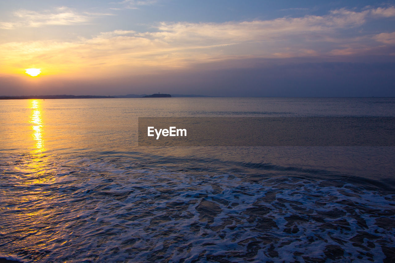 Scenic view of sea against sky during sunset