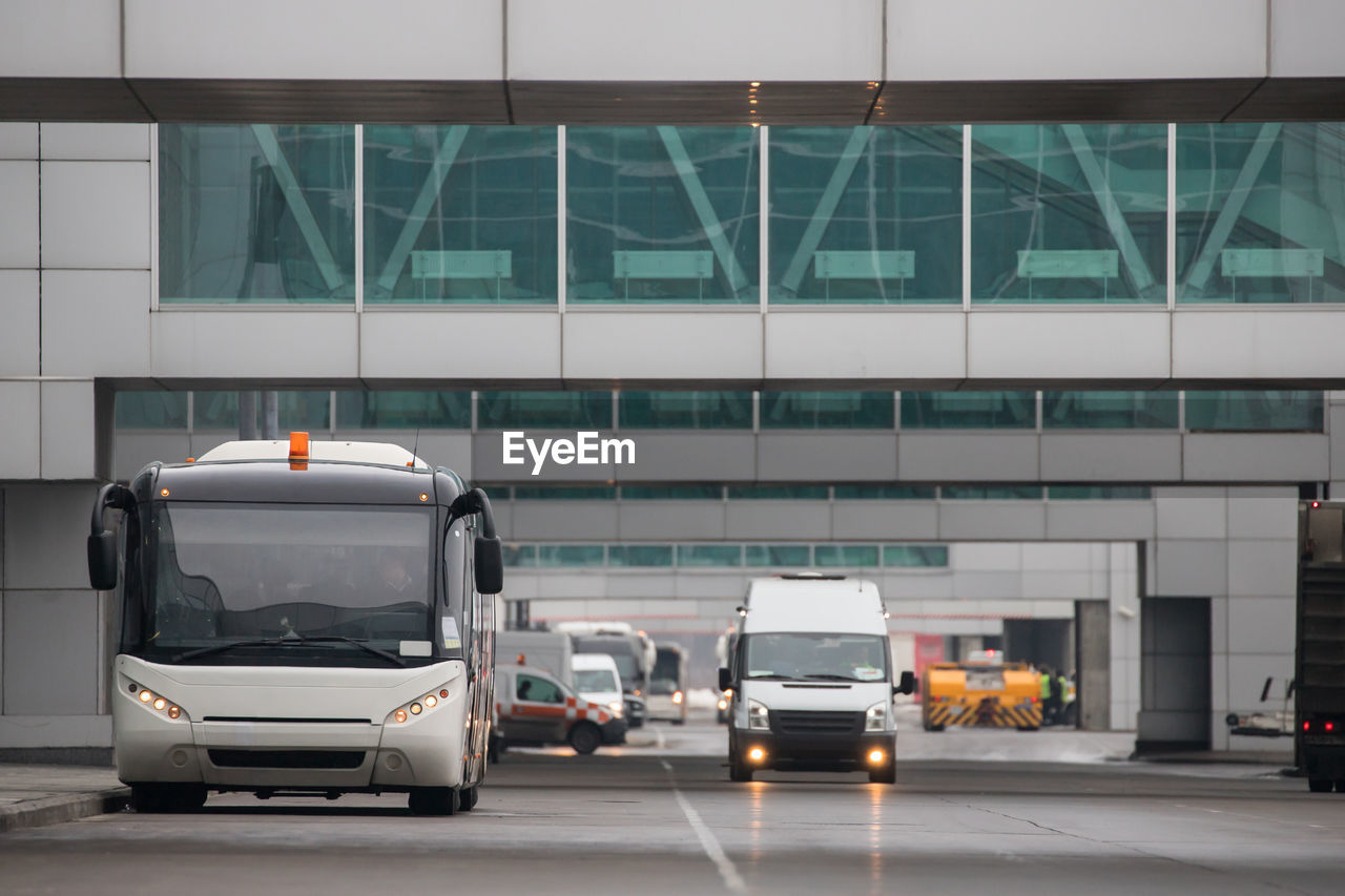 Airfield bus driving through the airport. shuttle bus for transportation of passengers at airport 