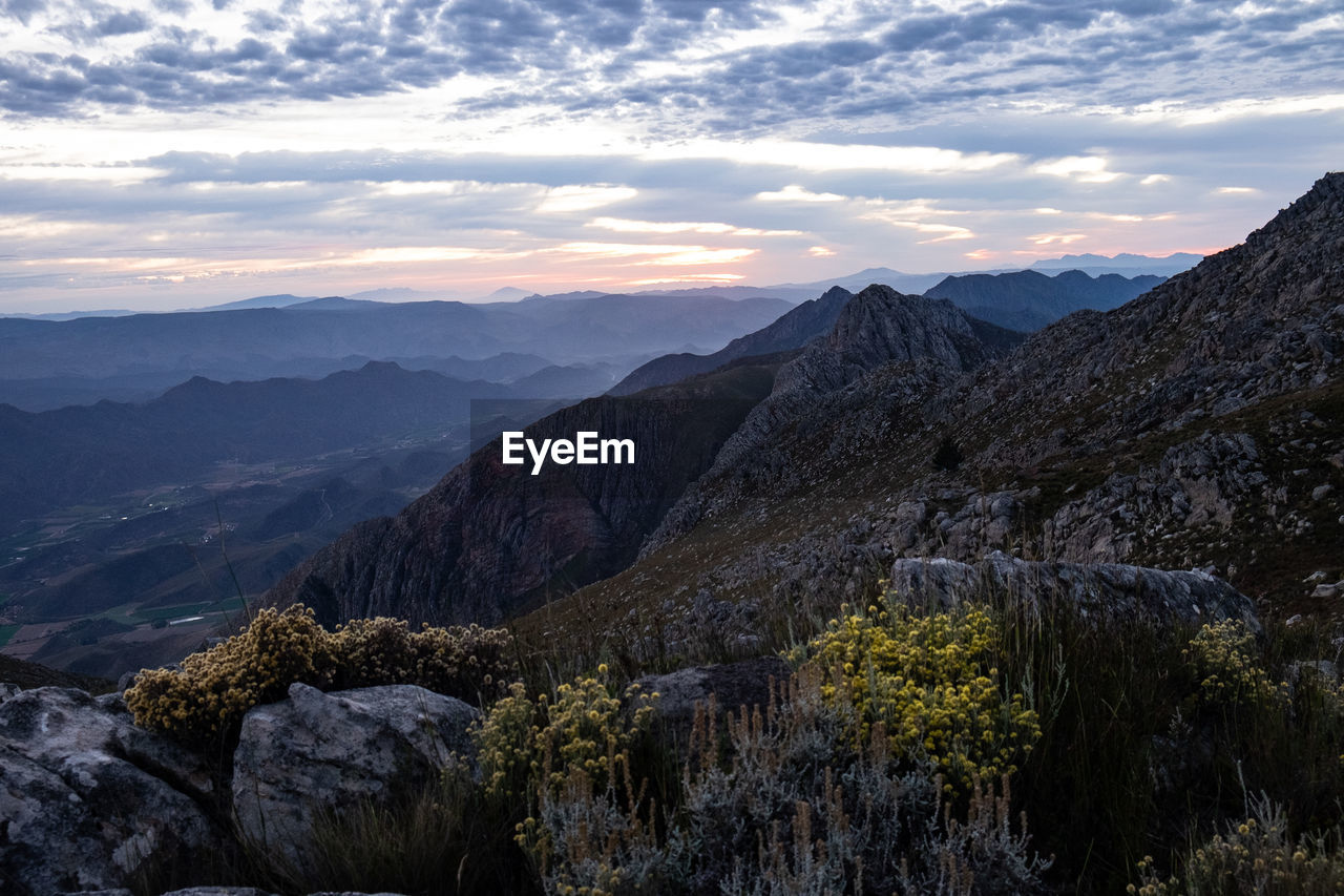 Scenic view of mountains against sky during sunrise