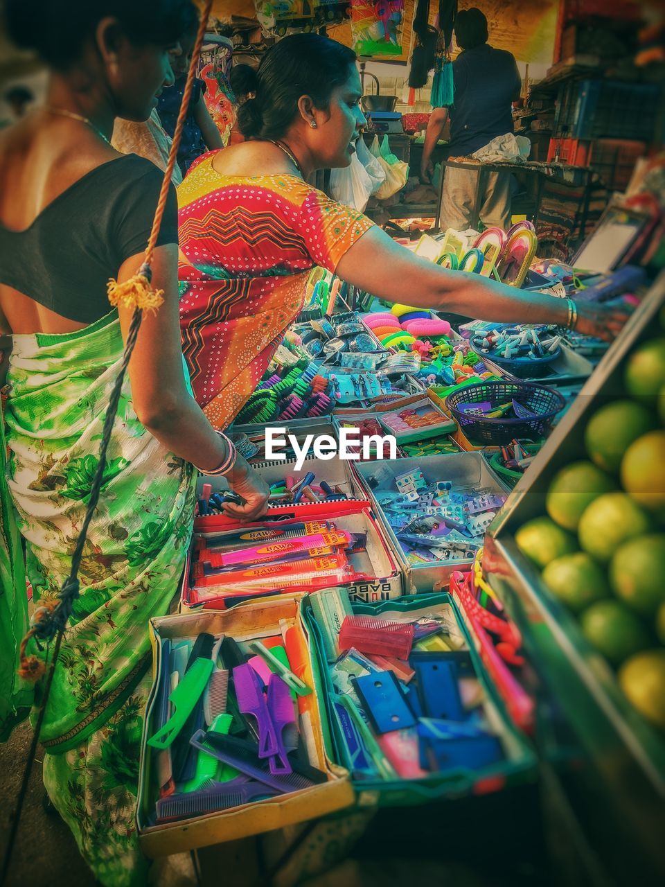 LOW ANGLE VIEW OF PEOPLE AT MARKET