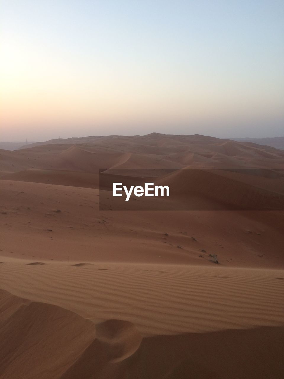 Scenic view of desert against clear sky