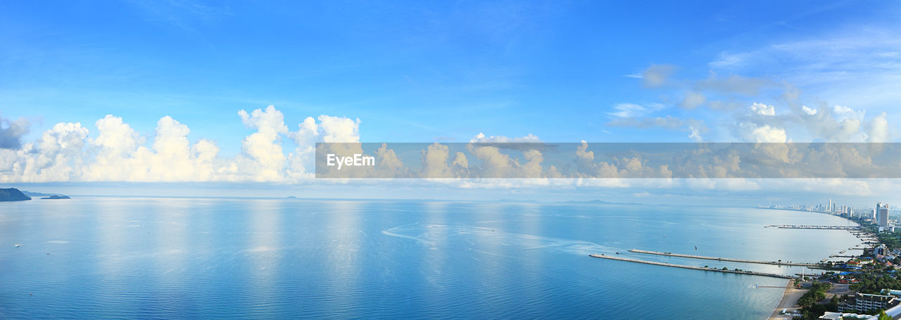 PANORAMIC SHOT OF BAY AGAINST BLUE SKY