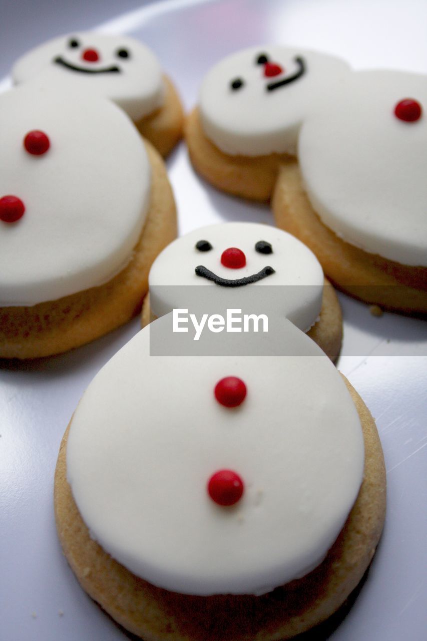 Close-up of snowman shaped gingerbread cookies in plate