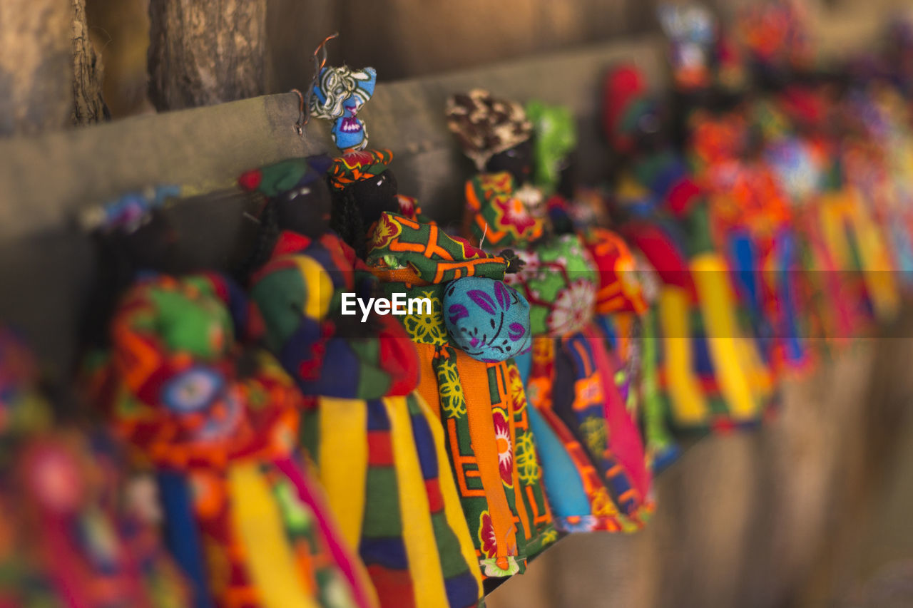 CLOSE-UP OF COLORFUL HANGING FOR SALE AT MARKET