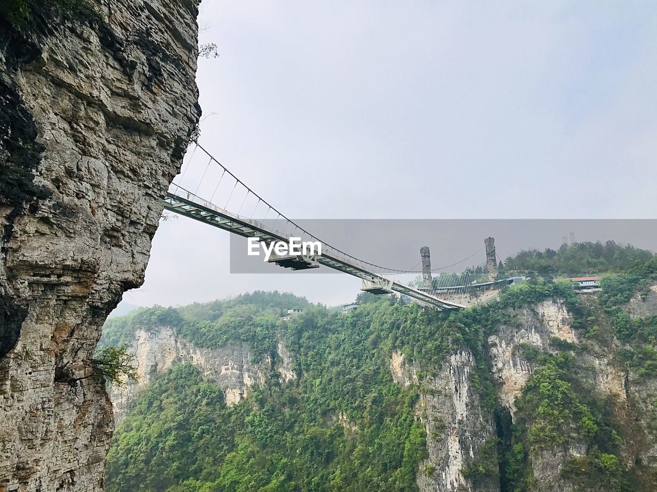 View of bridge over mountain against sky