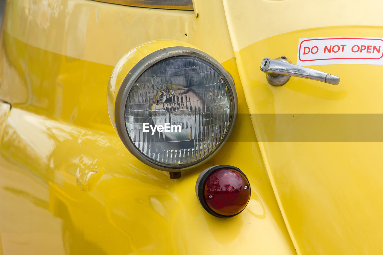 CLOSE-UP OF YELLOW CAR