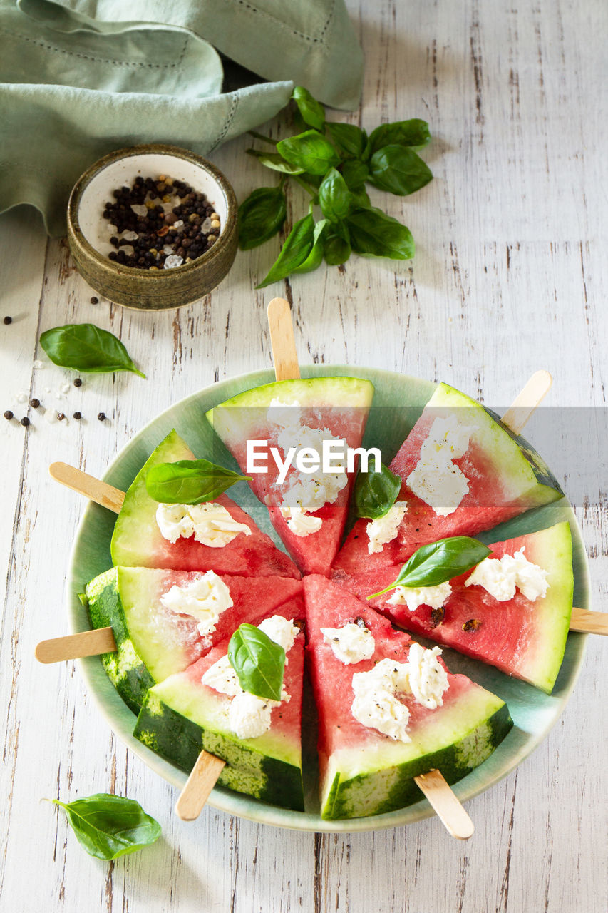 High angle view of fruits in plate on table