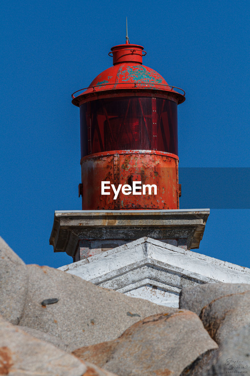 tower, architecture, built structure, blue, sky, clear sky, building exterior, lighthouse, nature, no people, red, history, day, low angle view, the past, building, outdoors, travel destinations, protection