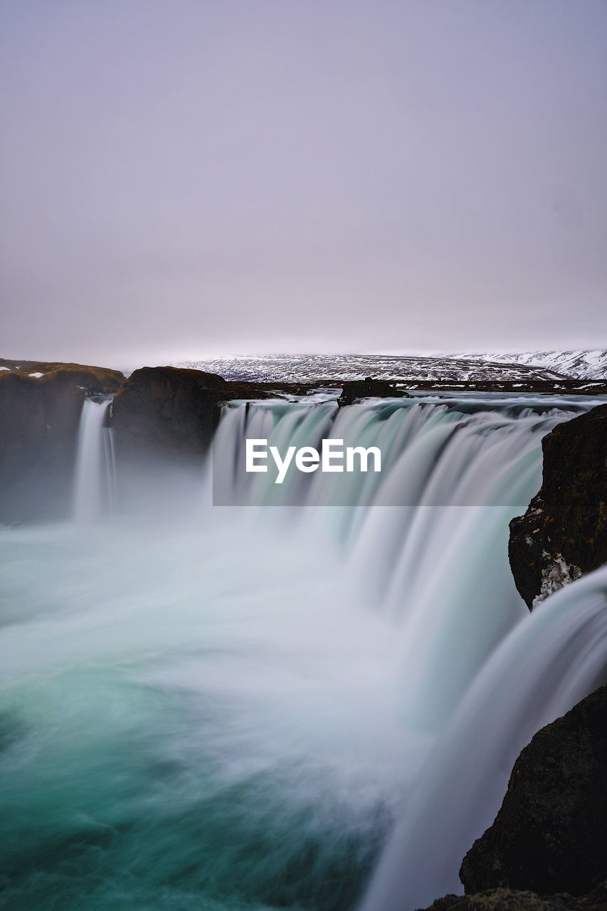 View of waterfall against sky