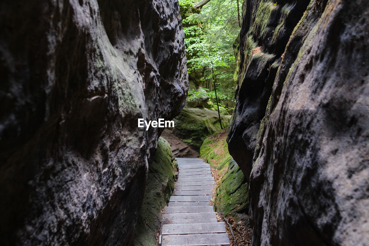 Narrow footpath amidst rock formation