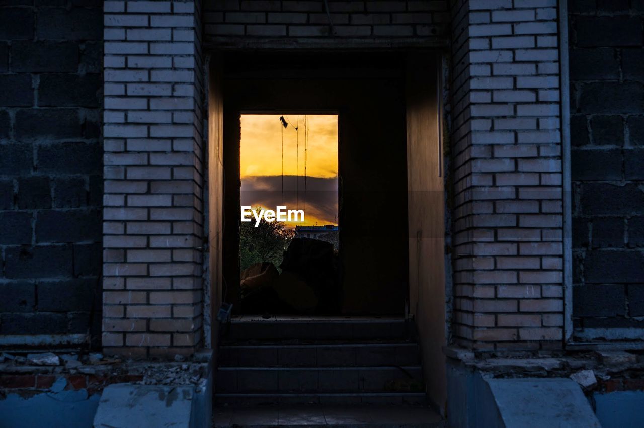 View of window by brick wall