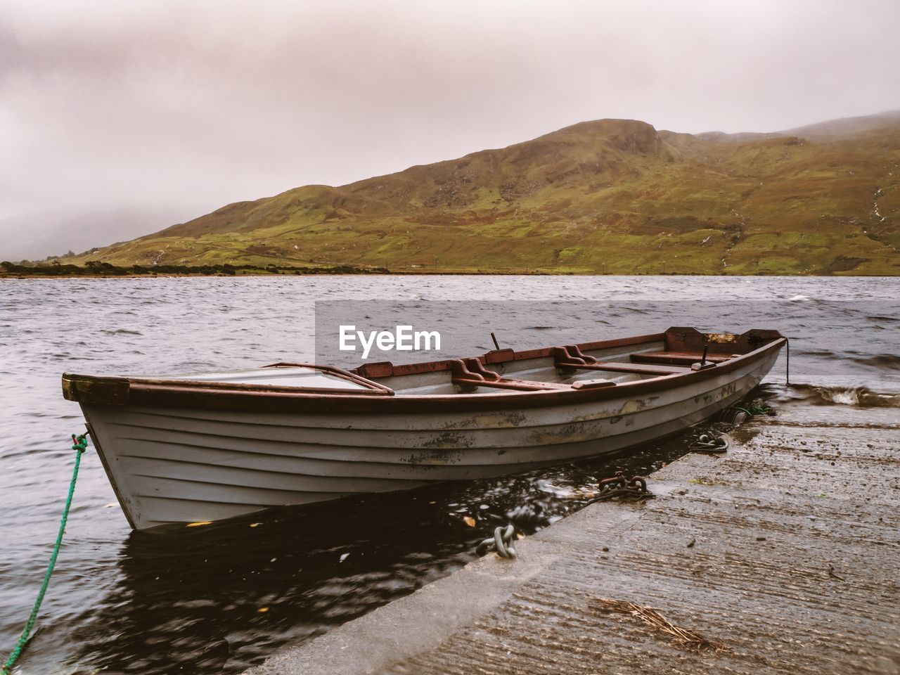 Fishing boat in the irish lake moody weather