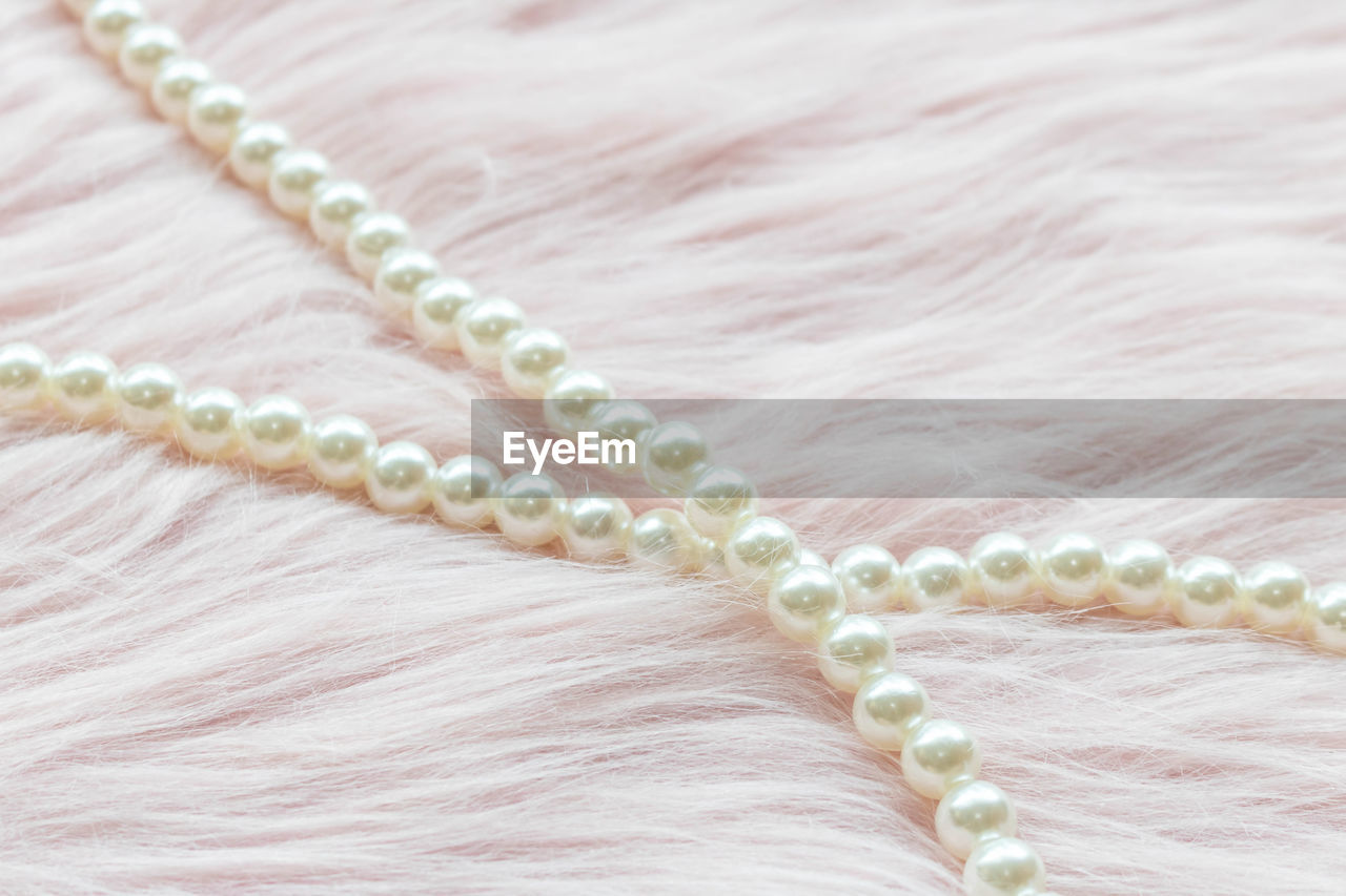 jewellery, jewelry, pearl jewelry, necklace, chain, close-up, textile, luxury, fashion accessory, wealth, pearl, no people, fashion, indoors, bead, elegance, white, pink, gemstone