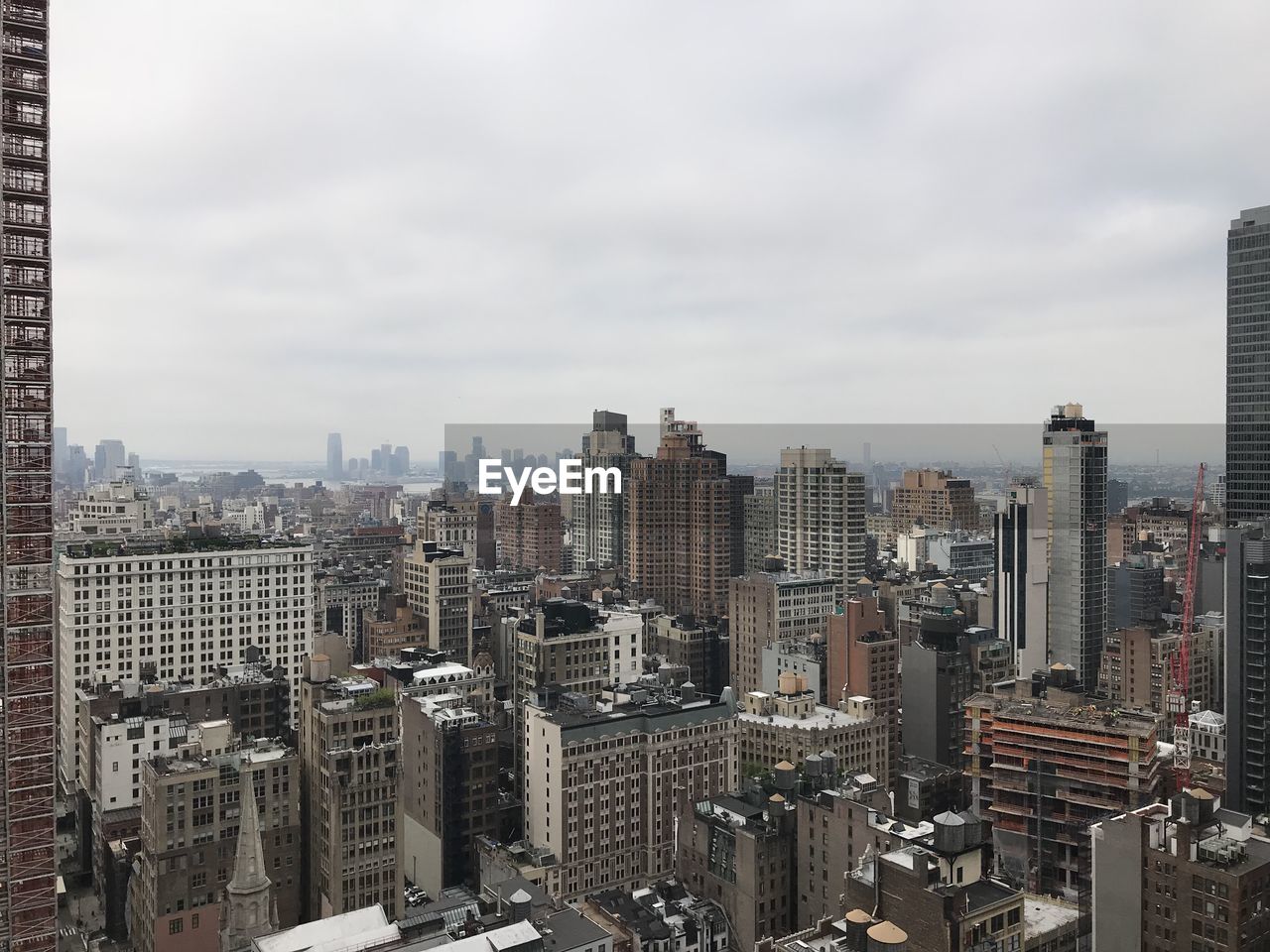 HIGH ANGLE VIEW OF MODERN BUILDINGS AGAINST SKY