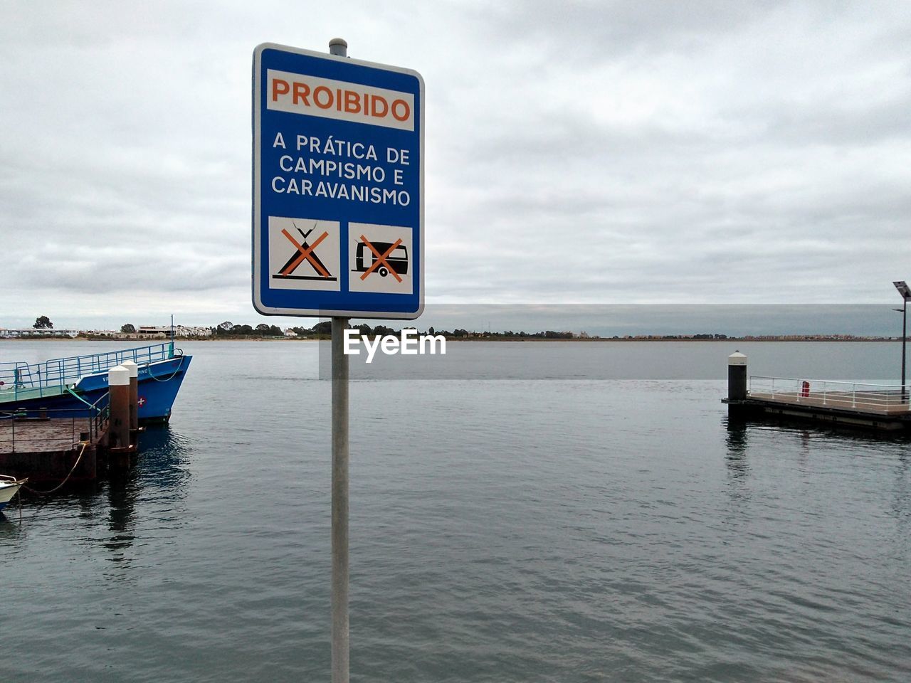 A no camping sign on the border of portugal and spain