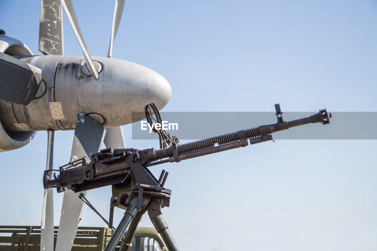 Low angle view of crane against clear sky