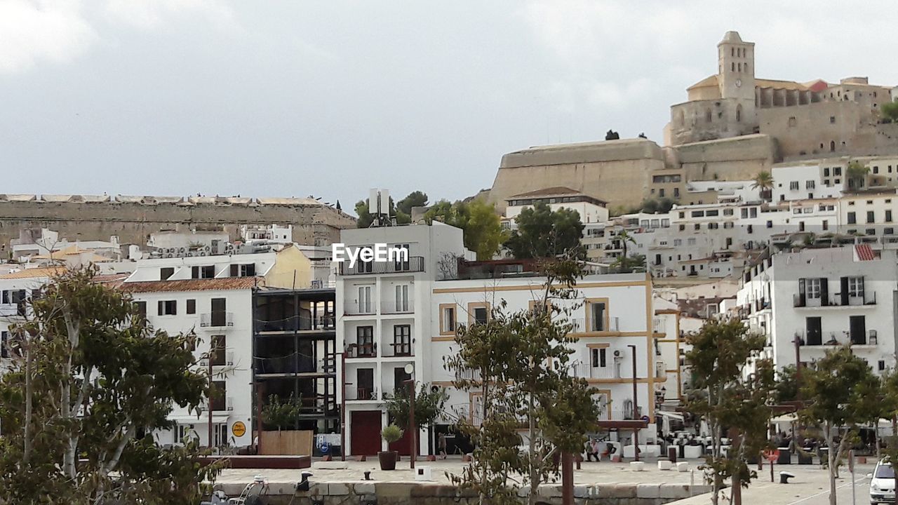 Buildings in city against sky