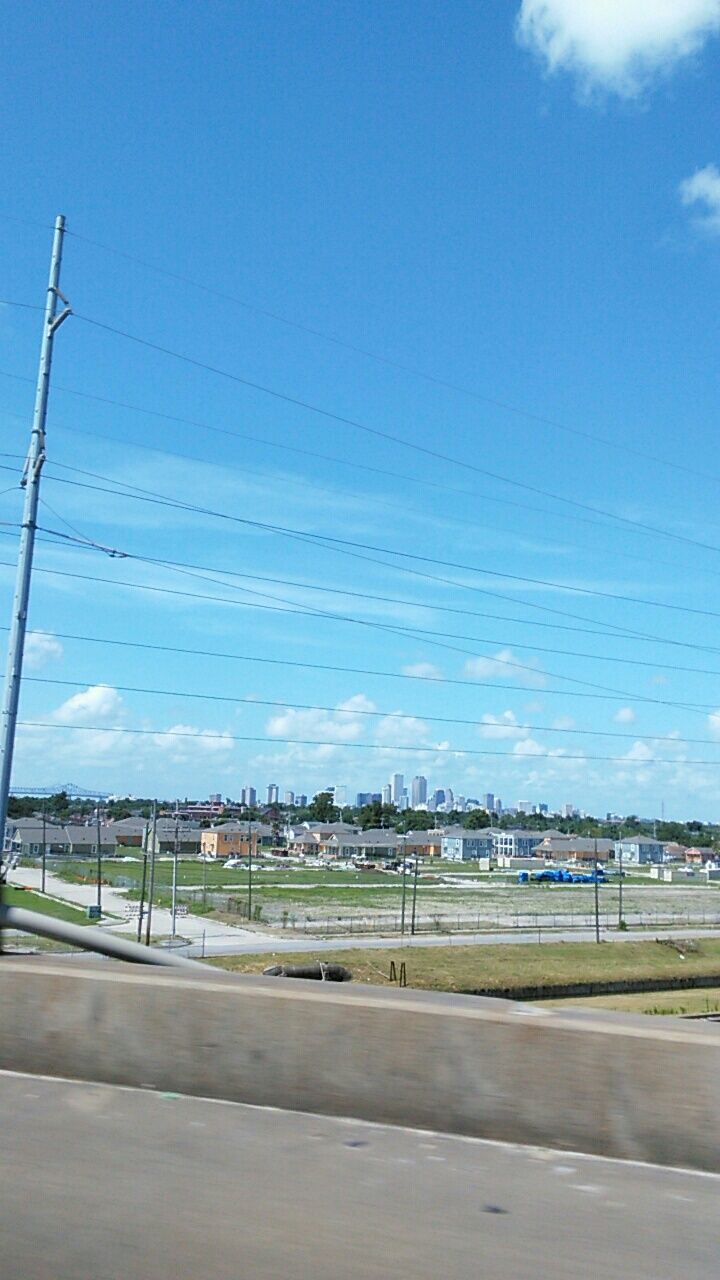 VIEW OF ROAD AGAINST BLUE SKY