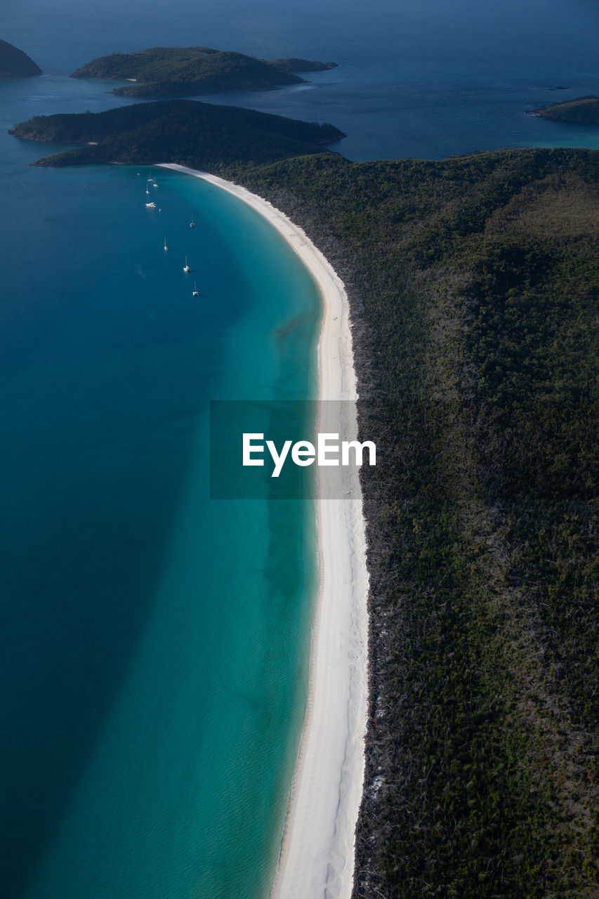 High angle view of sea shore against sky