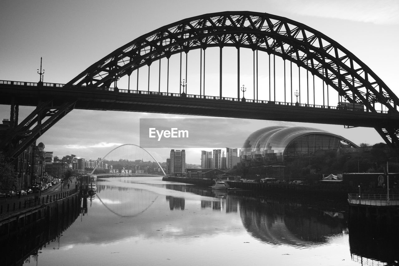 View of bridge over river in city