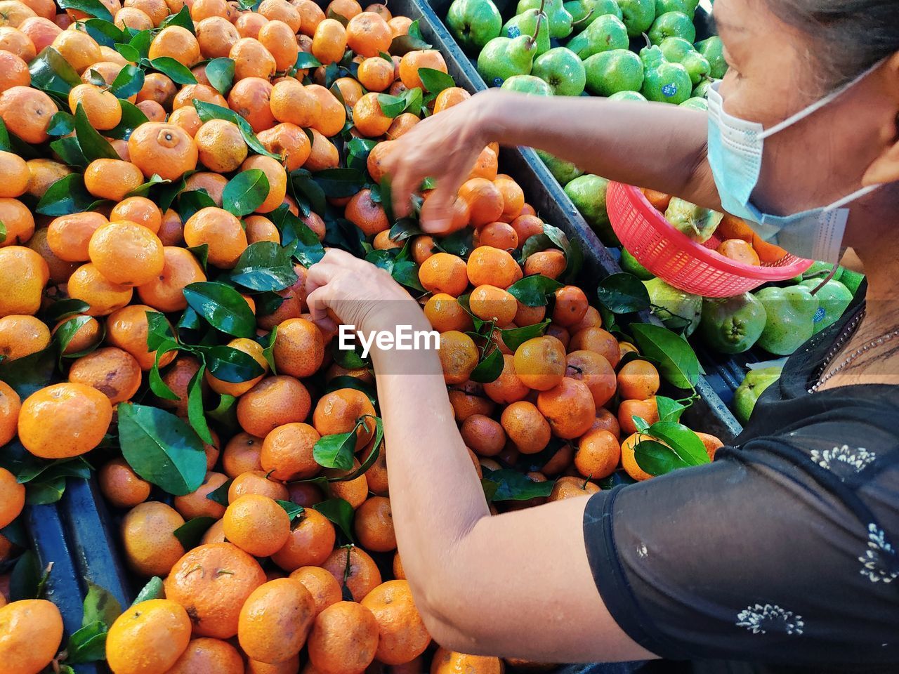 High angle view of orange fruits for sale in market