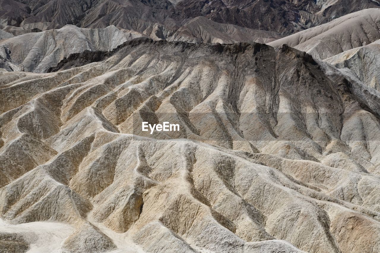 FULL FRAME SHOT OF ROCK FORMATIONS IN DESERT