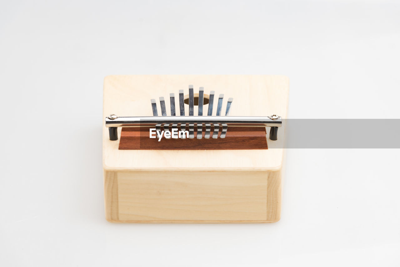 Close-up of mbira on white background