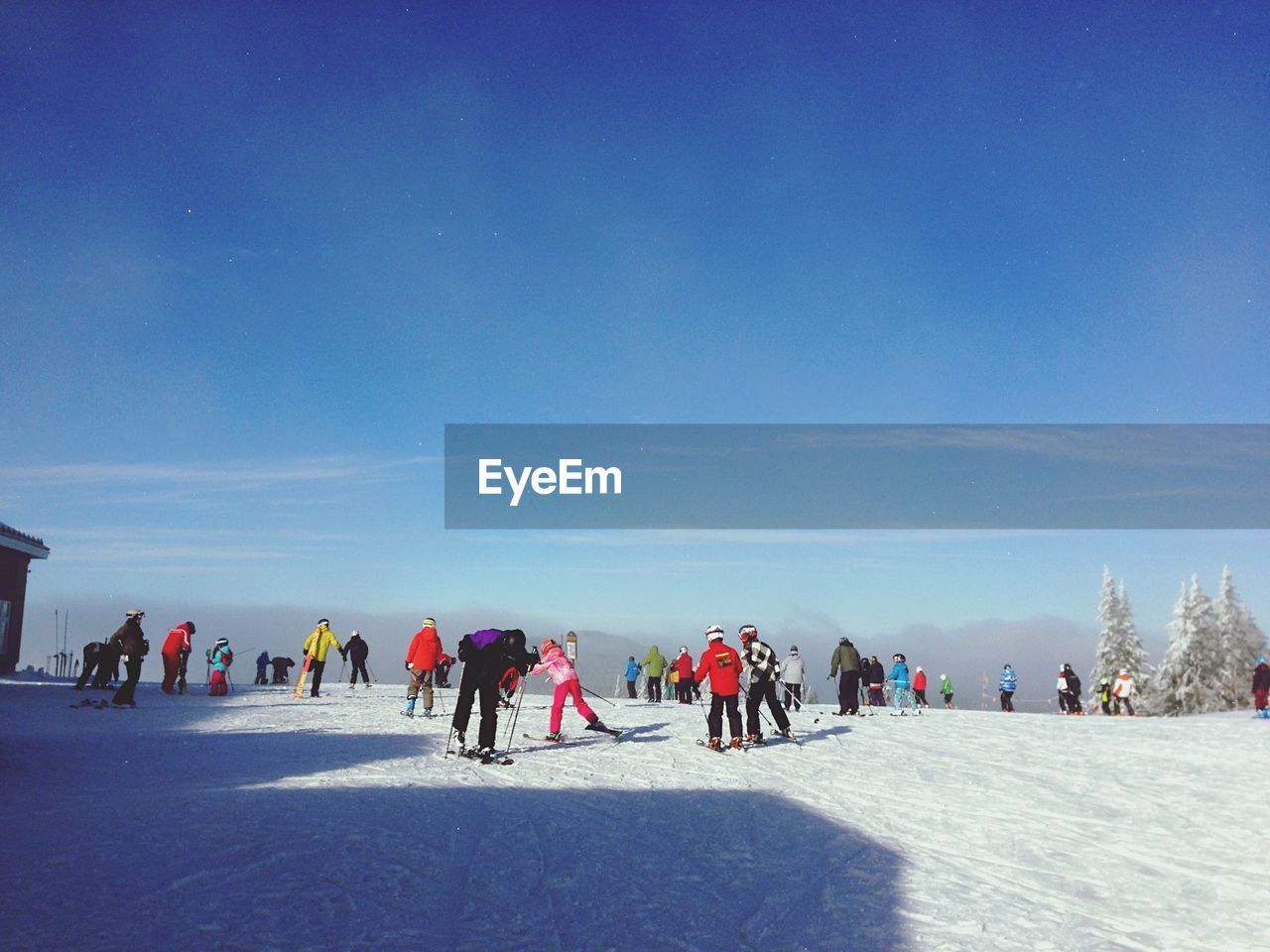 People skiing at mont-tremblant against blue sky