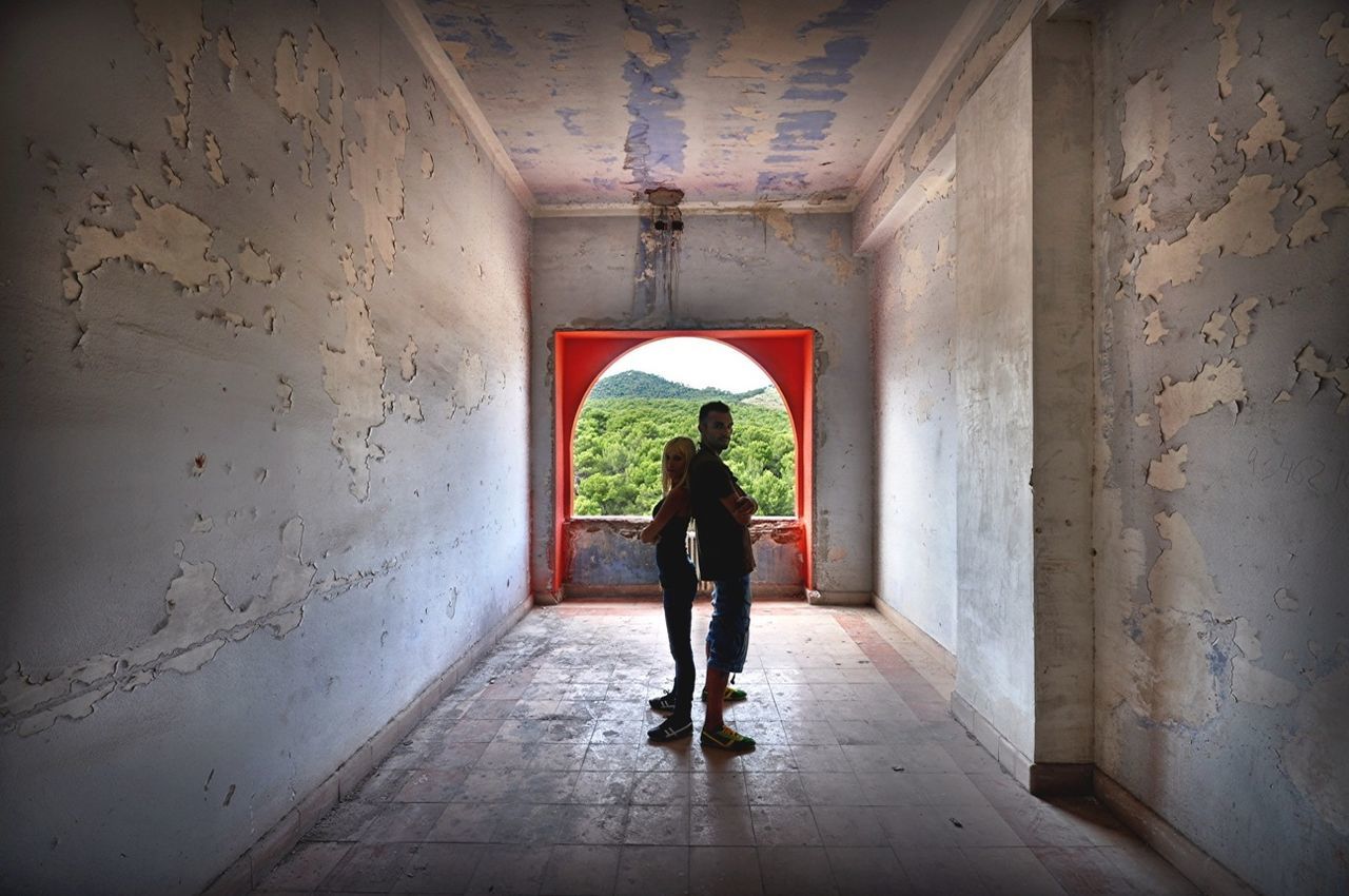 WOMAN WALKING IN TUNNEL