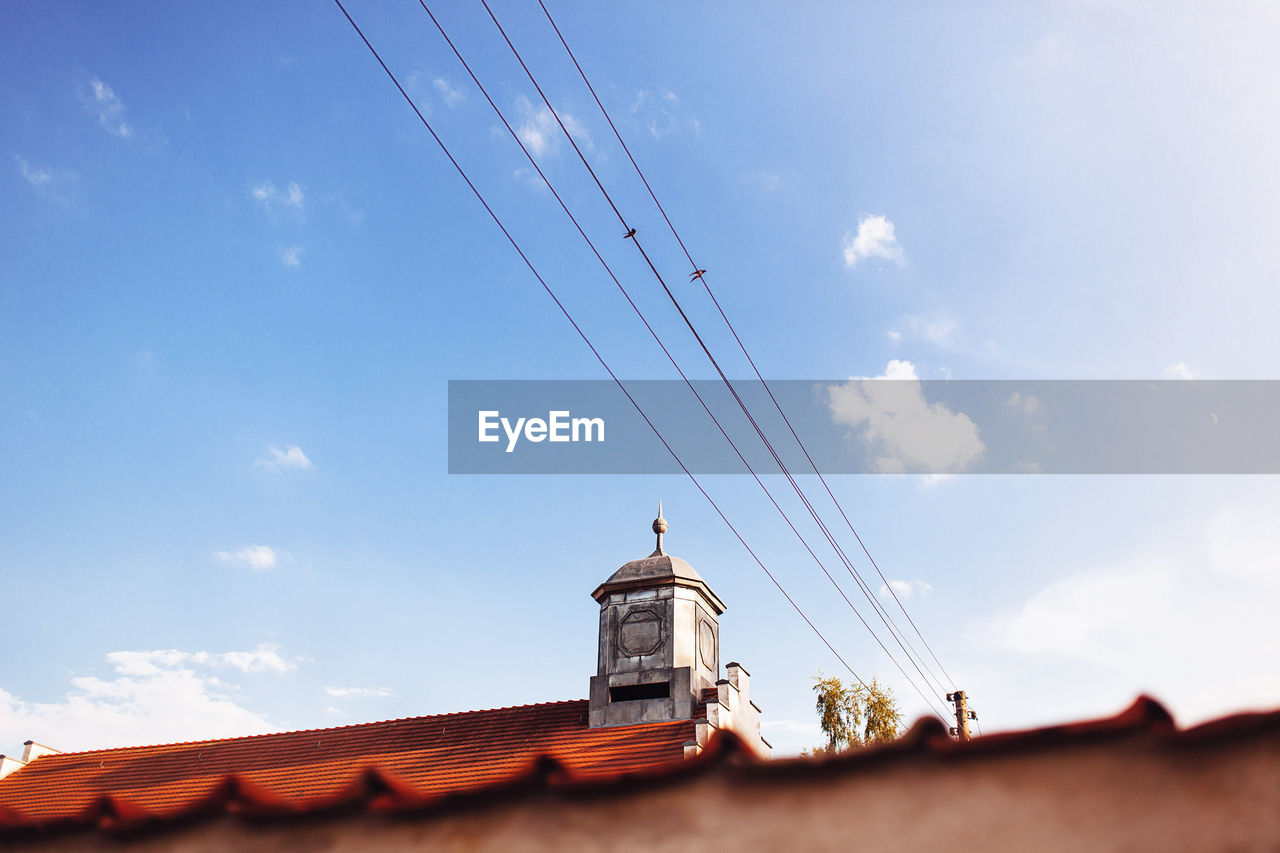 Low angle view of roof against sky