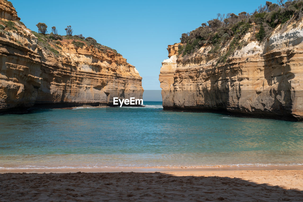 Scenic view of sea against clear blue sky