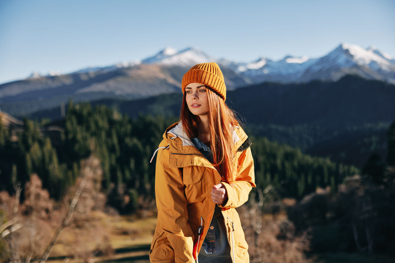 young woman standing on mountain