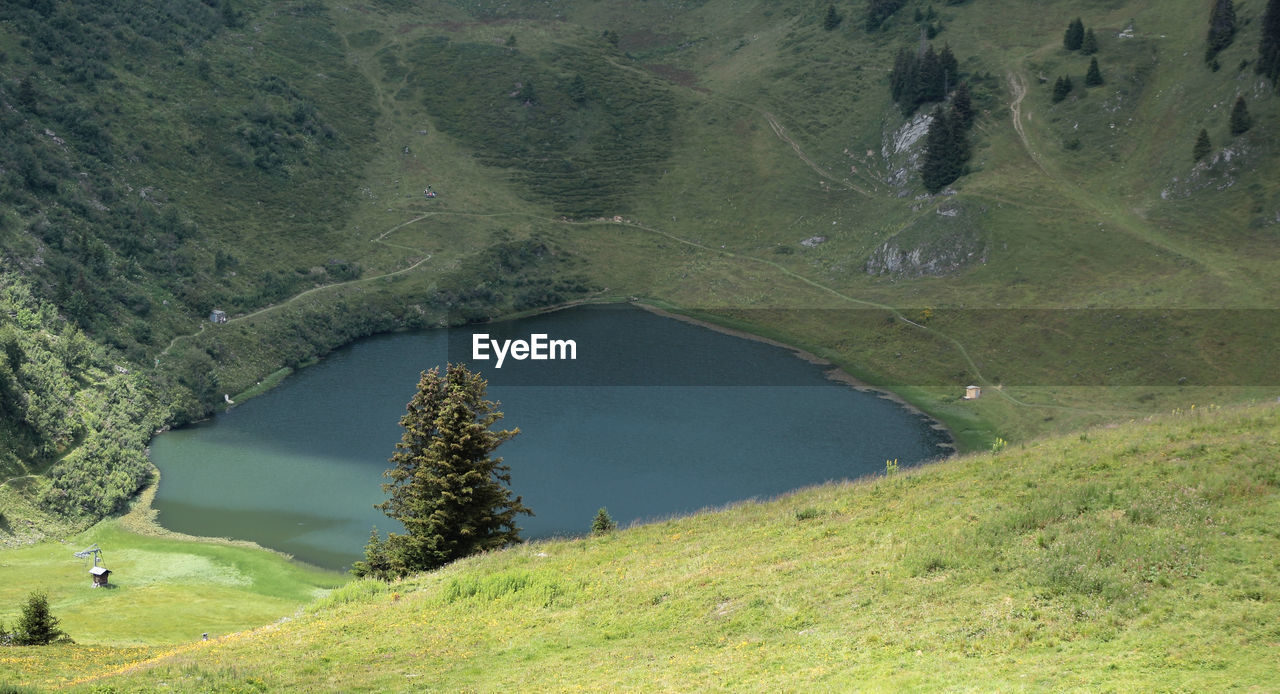 environment, water, landscape, plant, scenics - nature, beauty in nature, land, reservoir, nature, mountain, green, lake, mountain pass, tranquility, mountain range, non-urban scene, no people, tree, grass, tranquil scene, high angle view, day, aerial photography, highland, ridge, outdoors, travel destinations, plateau, travel, valley, activity, idyllic, forest, tourism