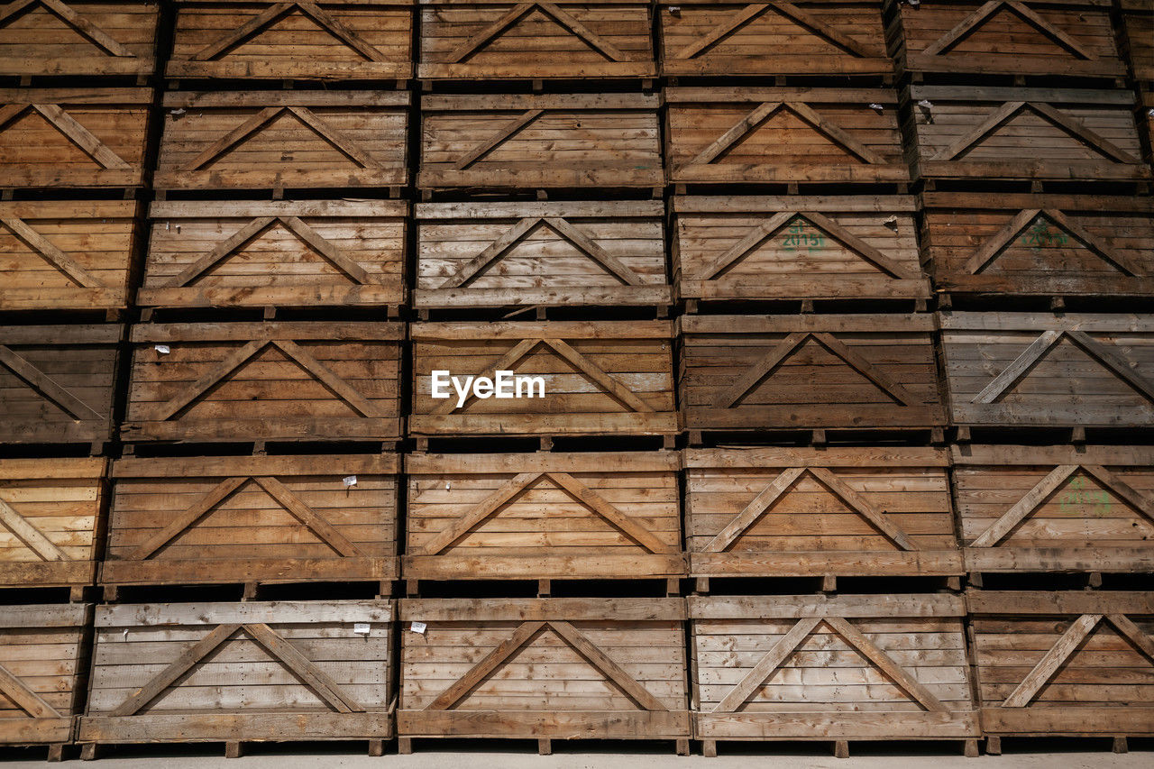 full frame, pattern, architecture, backgrounds, built structure, no people, wall, wood, line, floor, shape, repetition, metal, building exterior, day, brick, flooring, geometric shape, building, in a row, brown, art, outdoors, roof, textured